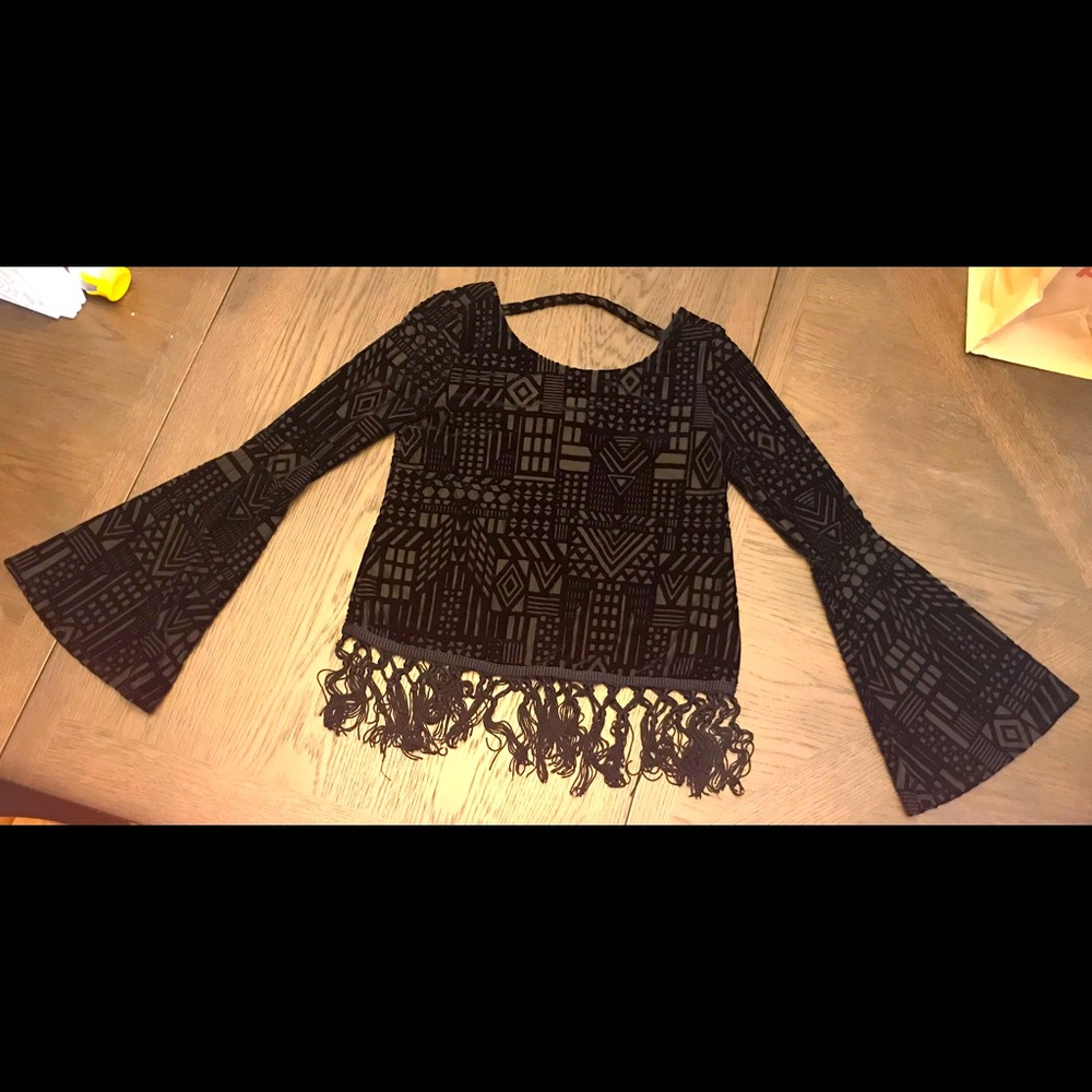 Black long sleeve top with fringe bottom